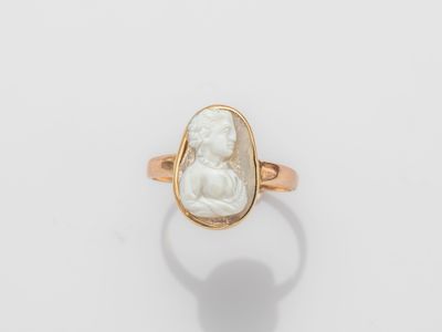 an image of a gold ring with a white stone in the center
