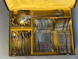 a box with a bunch of silver spoons and spoons in it