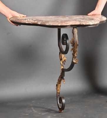 a person that is holding a table with a piece of wood on it