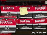 many boxes of beer on the shelf in the store