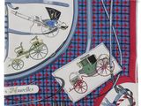 une image représentant un mouchoir bleu et rouge orné d'une illustration d'une calèche