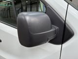 an image of a side view mirror of a white van