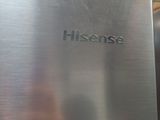 a close up of a stainless steel refrigerator with the word hisense written on it