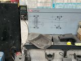 a picture of a workbench in a garage filled with tools
