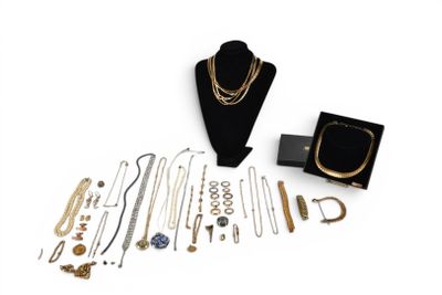 an assortment of gold and silver jewelry including a necklace, bracelet, and ring