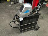 an image of a welding helmet on a cart in a garage