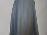 the back of a cape is shown on a mannequin stand
