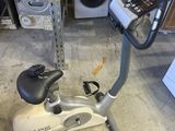 a stationary exercise bike with a cell phone on top of it