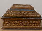 an old wooden box with a blue and gold design on it