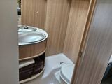 a small bathroom with a sink and a toilet in it