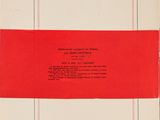 a red and white book with a red stripe on it