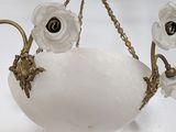 an image of a chandelier made of glass and brass