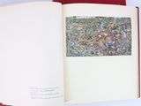 an open book with a picture of a city on it