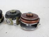 three different types of pots sitting on a table