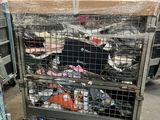 a metal cart with many items in it in a warehouse