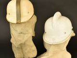 three different types of hats and boots on a black background
