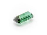 a green tourmaline gems on a white background