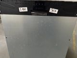an image of a dishwasher sitting on a pallet in a warehouse