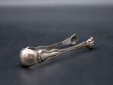 two spoons and a fork sitting on a table