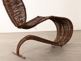 an image of a chair made out of wickers in a room