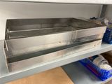 a metal shelf with two bins on top of it