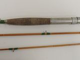 three different types of fishing rods are lined up on a white surface