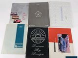 a lot of books that are sitting on a table