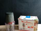 a small blender sitting on a table next to a box of food