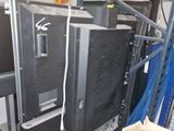 two televisions that are sitting in a room
