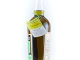 an image of a bottle of olive oil on a white surface
