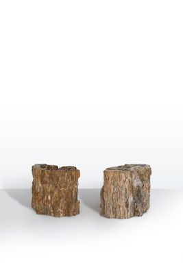 two pieces of wood sitting next to each other on a white surface