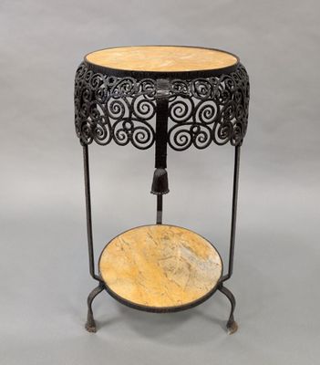 a black and gold table with a marble top on a stand
