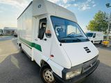 a white van that is parked in a parking lot