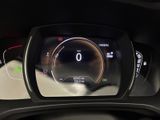 the dashboard of a car with a digital display on it
