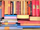 a box full of books sitting on top of a table
