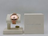 michael kors rose gold watch on display in a white box