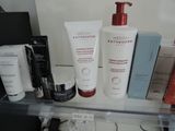 a shelf with a lot of beauty products on it