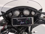 a close up of a motorcycle ' s dashboard with various gauges