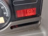a close up of a car dashboard with a clock on it