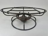 a metal basket that is sitting on top of a table
