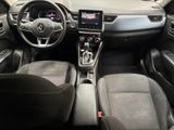 the interior of a car with a steering wheel, dashboard, and dashboard controls