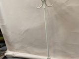 an image of a white coat stand with a coat rack