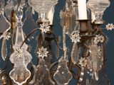 a chandelier made of glass hanging from the ceiling