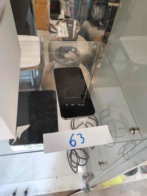 a picture of a cell phone on display in a glass case