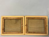 pair of antique wooden picture frames with glass inserts
