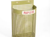 a green trash can with a paper sign on it