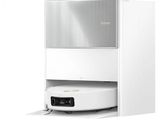 un robot posé sur un meuble blanc