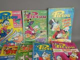 a lot of cartoon books that are on the table