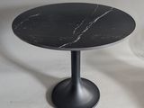 a black table with a marble top on a white background