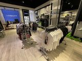a lot of clothes on display in the store
